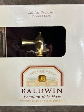 Baldwin Brass Hardware Packaging with Gold and Burgundy Accents